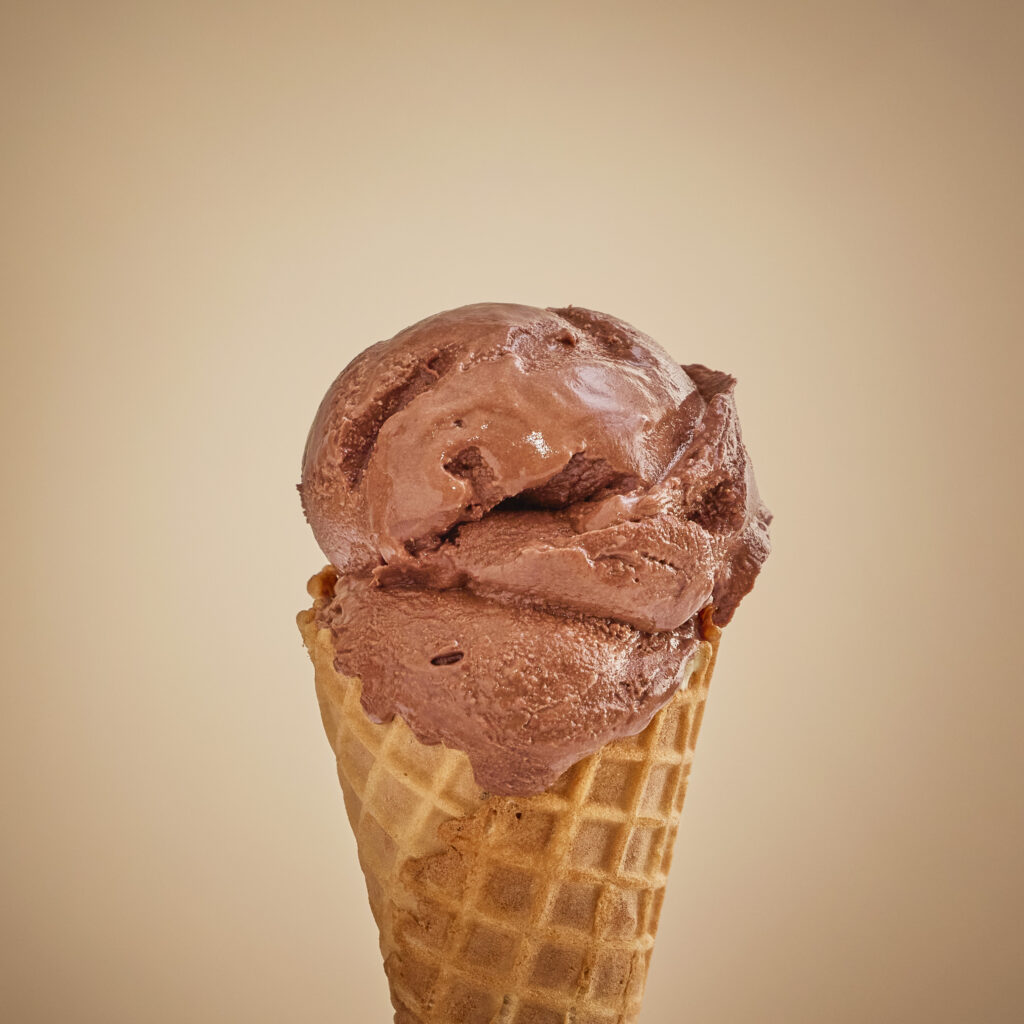 Double scoop of chocolate ice cream on a waffle cone