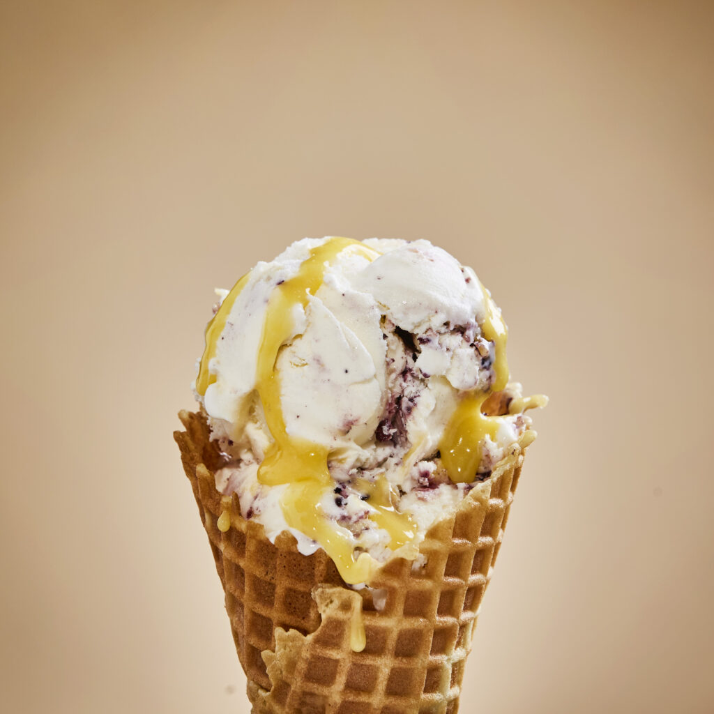 Lemon Berry Bliss ice cream in a waffle cone