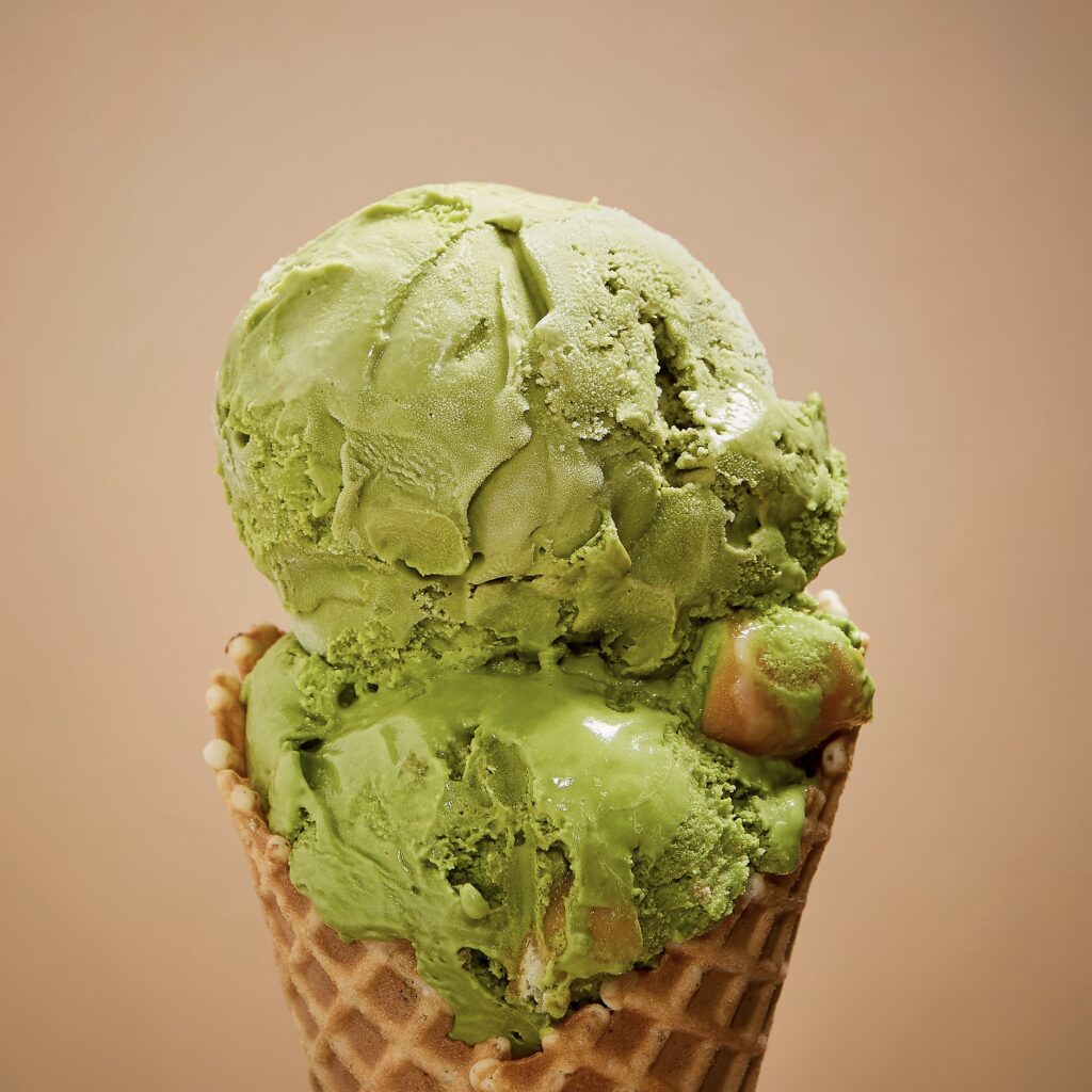 double scoop of matcha ice cream on a waffle cone